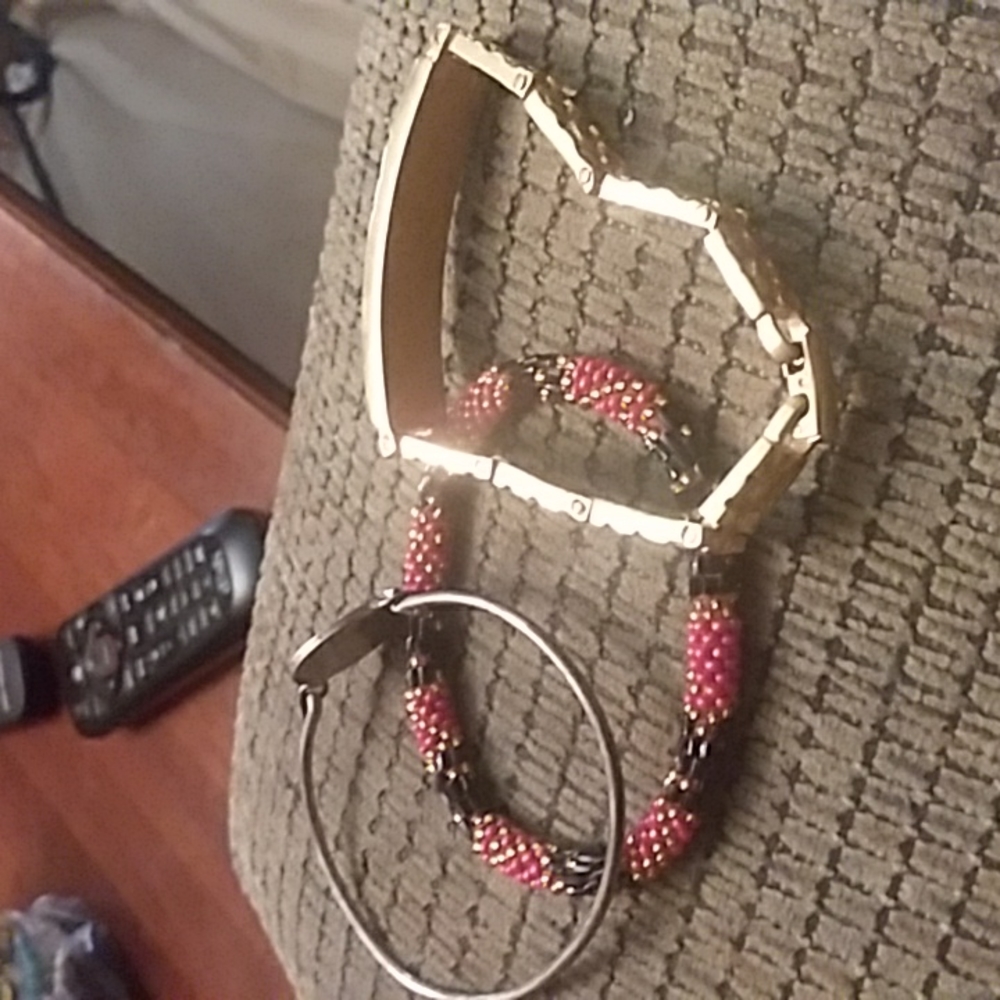 Red and black and gold bracelet  and wasit